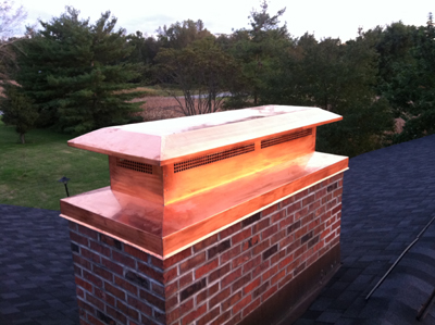 Before and after chimney cap replacement in Levittown, NY