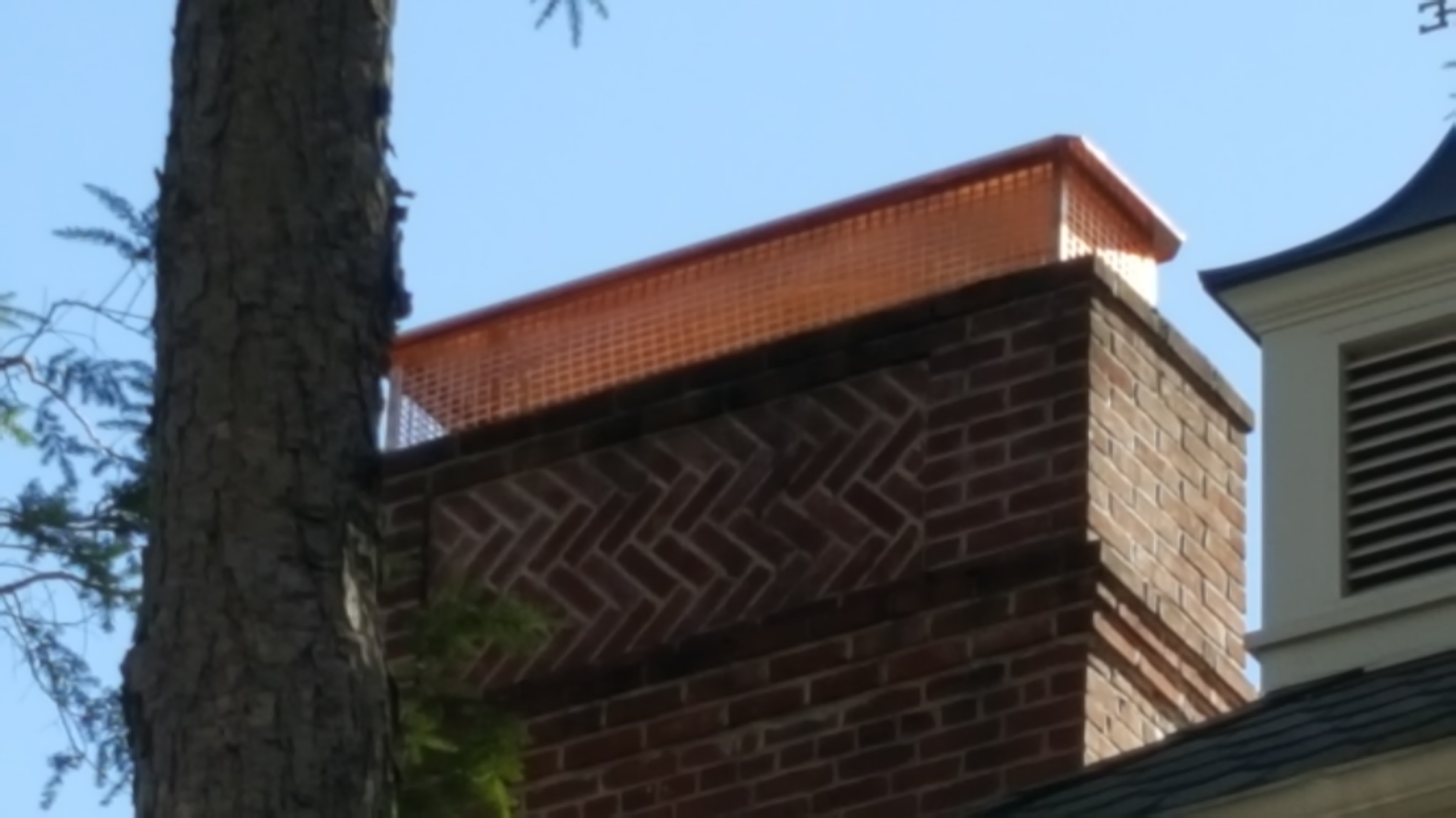 New stainless steel chimney cap installed in Levittown, NY