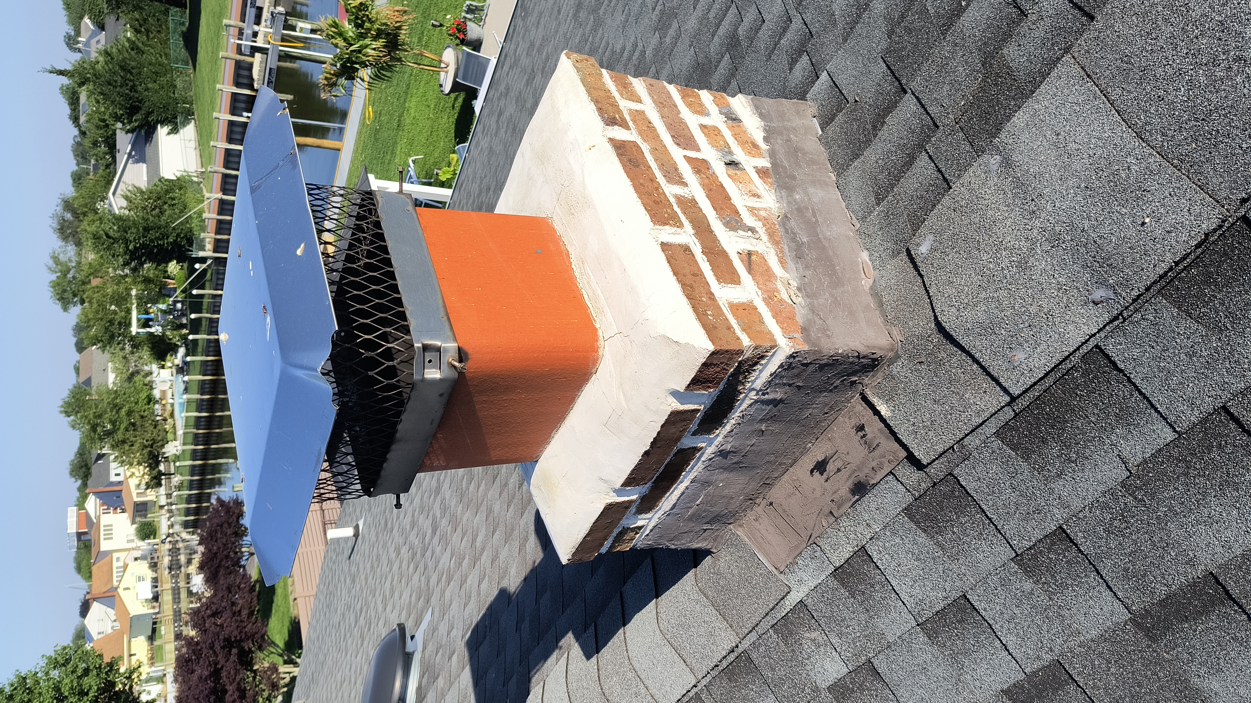 Full chimney masonry rebuild and restoration in Levittown, NY
