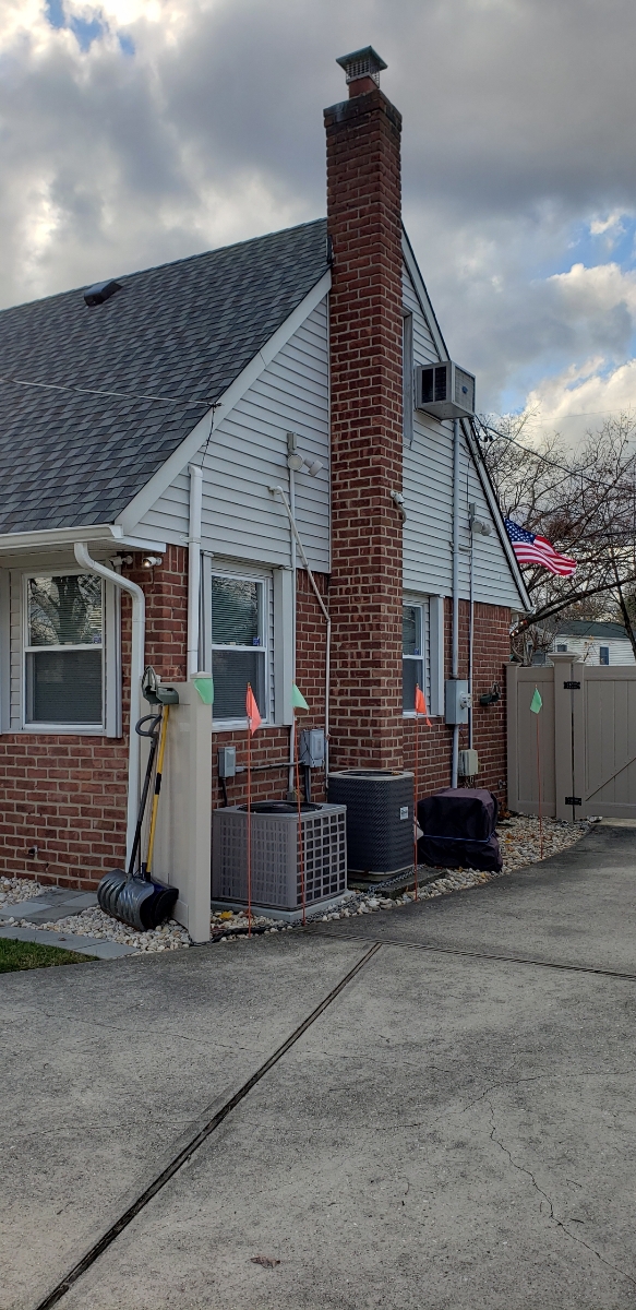 Professional chimney repointing restoring brick joints in Levittown, NY